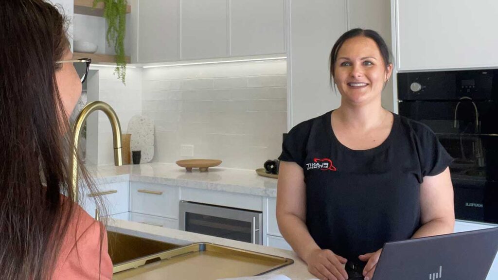 Kate with a client in the Planit Kitchens Collaroy showroom